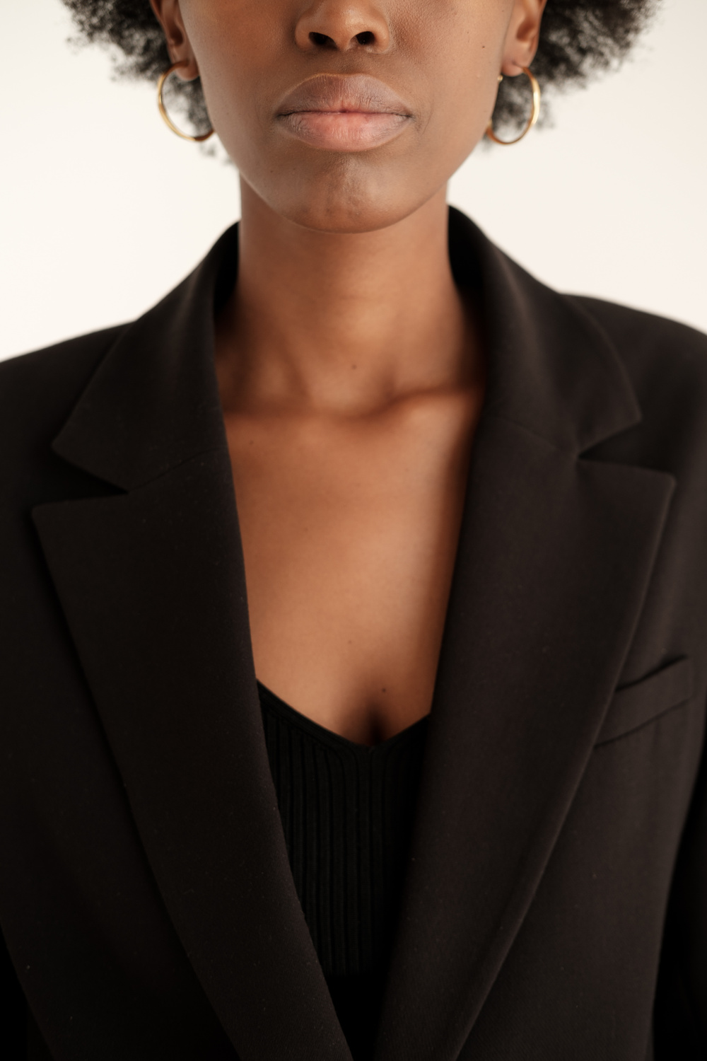 Woman in Black Blazer and Crop Top 
