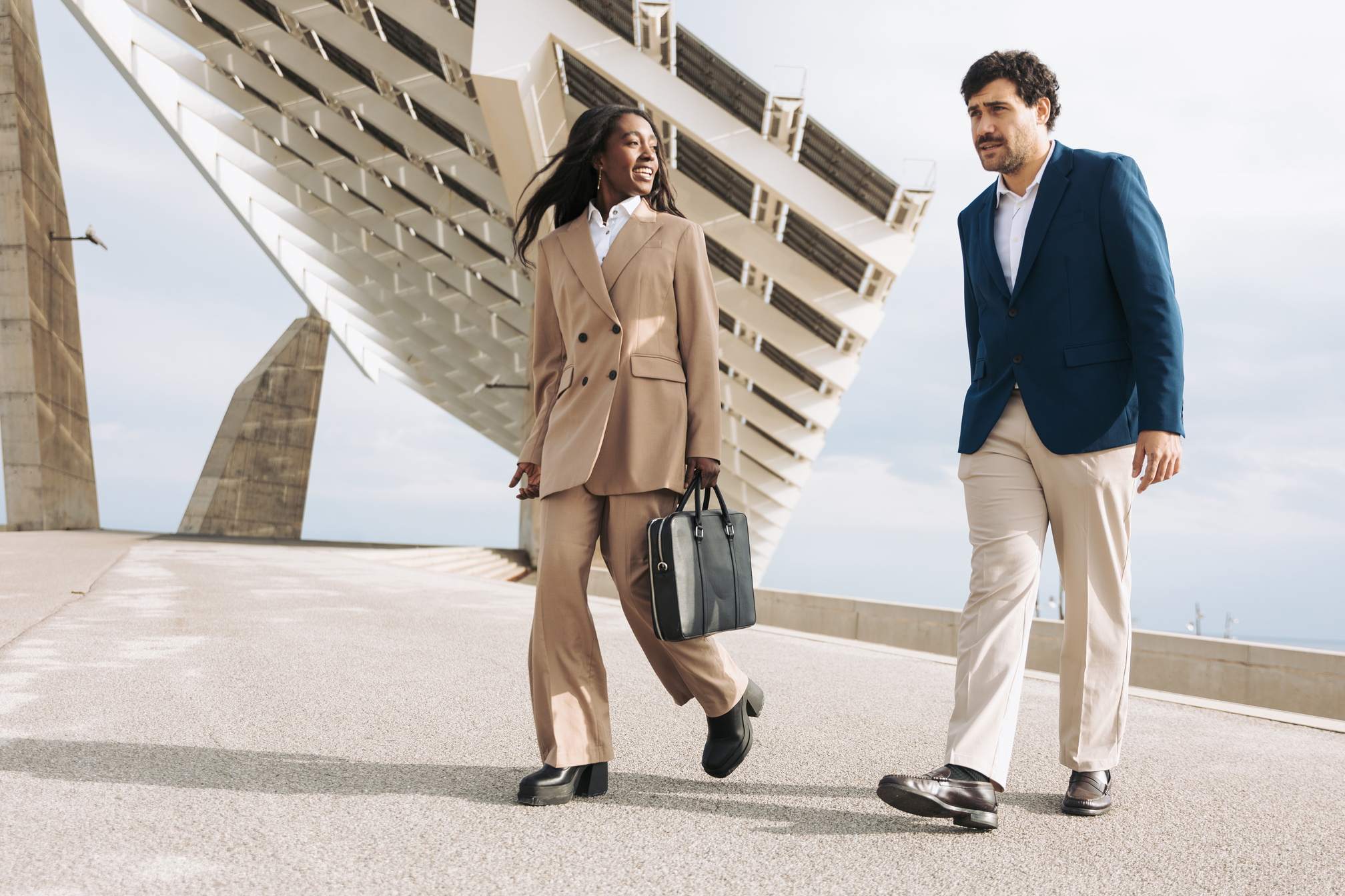 Male and Female Business Travelers Outdoors